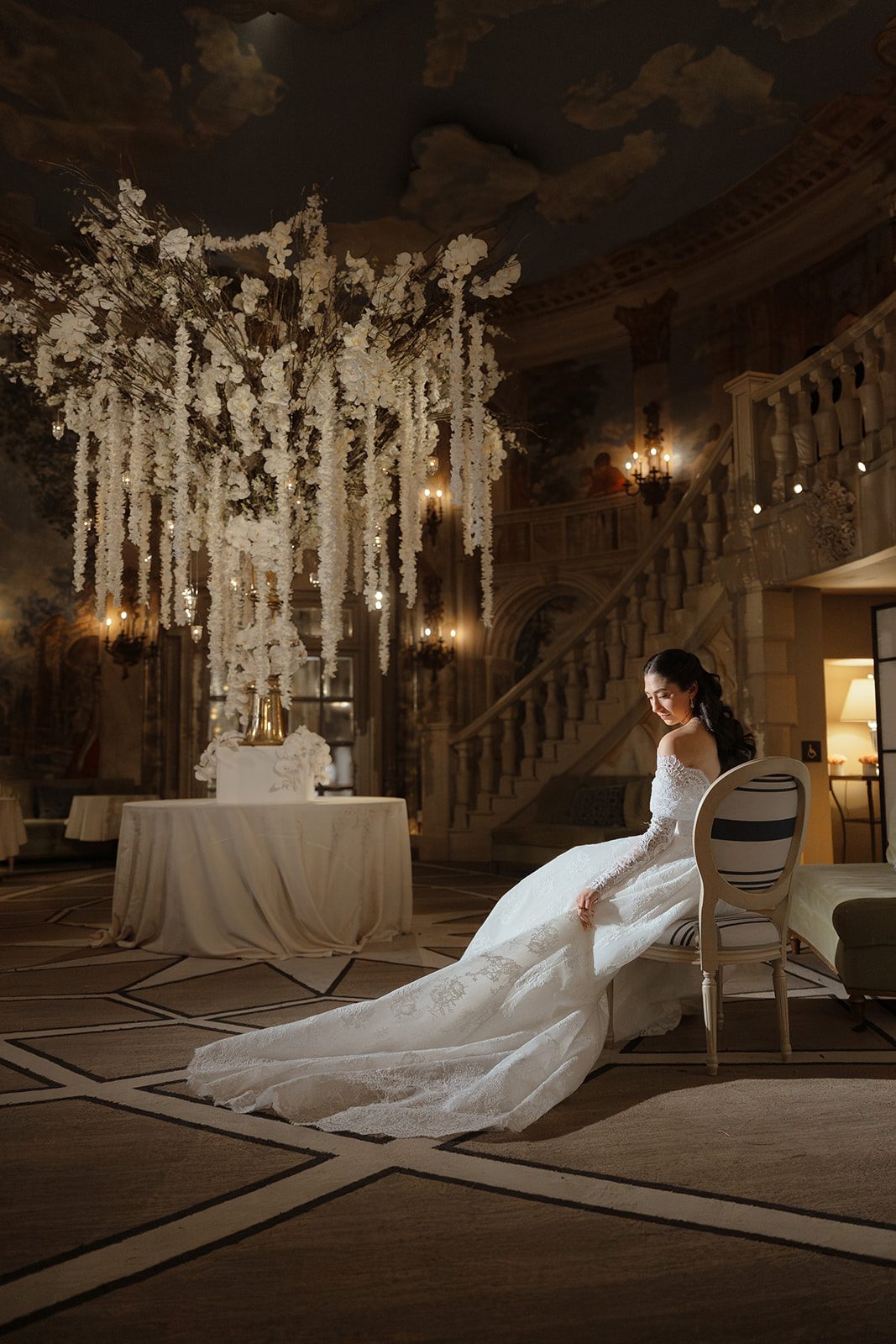 Dori seated with her train spread before the ceremony