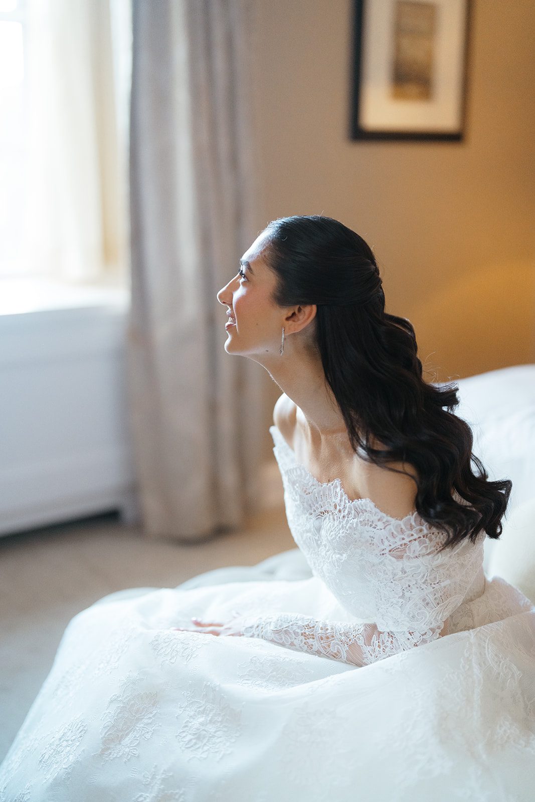 Dori in window light in her gown at The Pierre