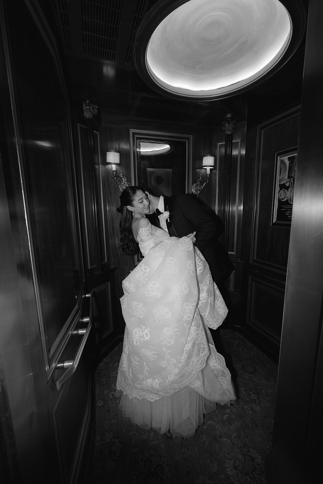 Dori and Ben in the elevator at The Pierre, black and white