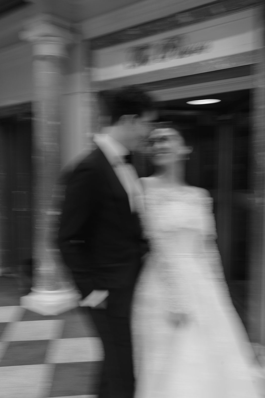 Dori and Ben crossing Fifth Avenue in black and white