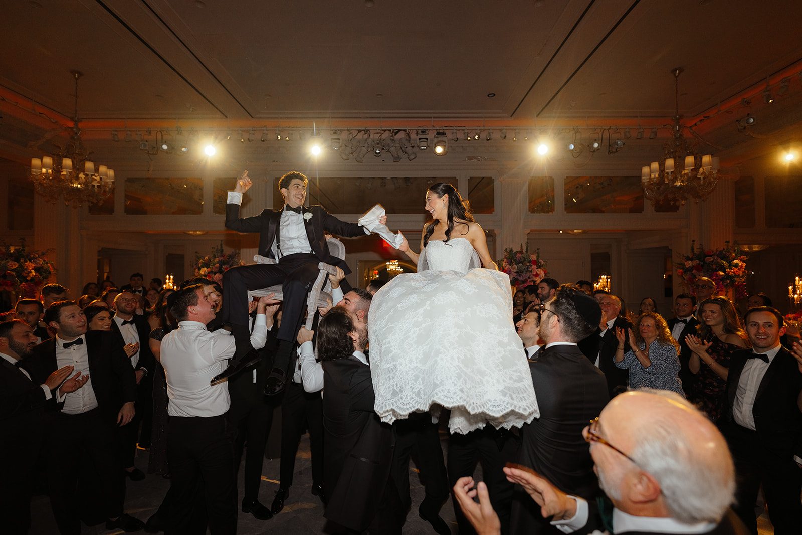 Dori and Ben lifted on chairs during the hora