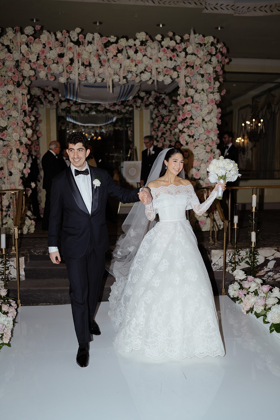 Dori and Ben walk back up the aisle as husband and wife