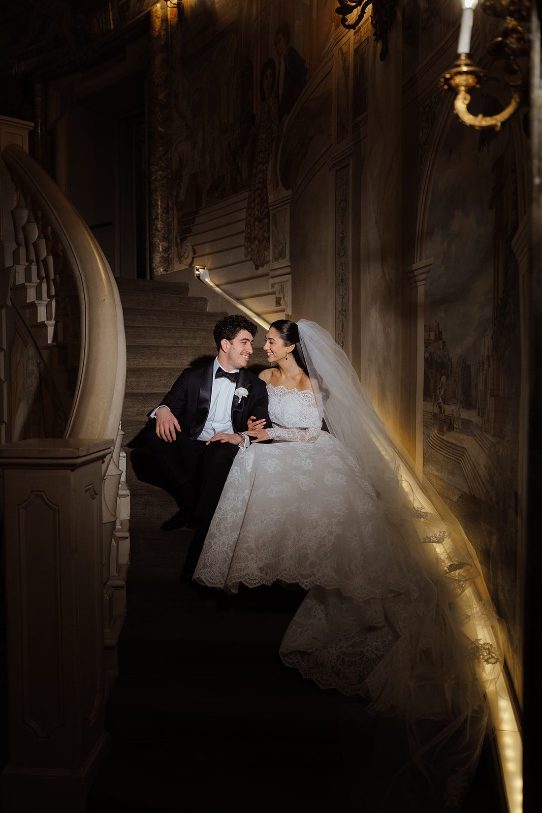 Dori and Ben embrace on the Rotunda stairs