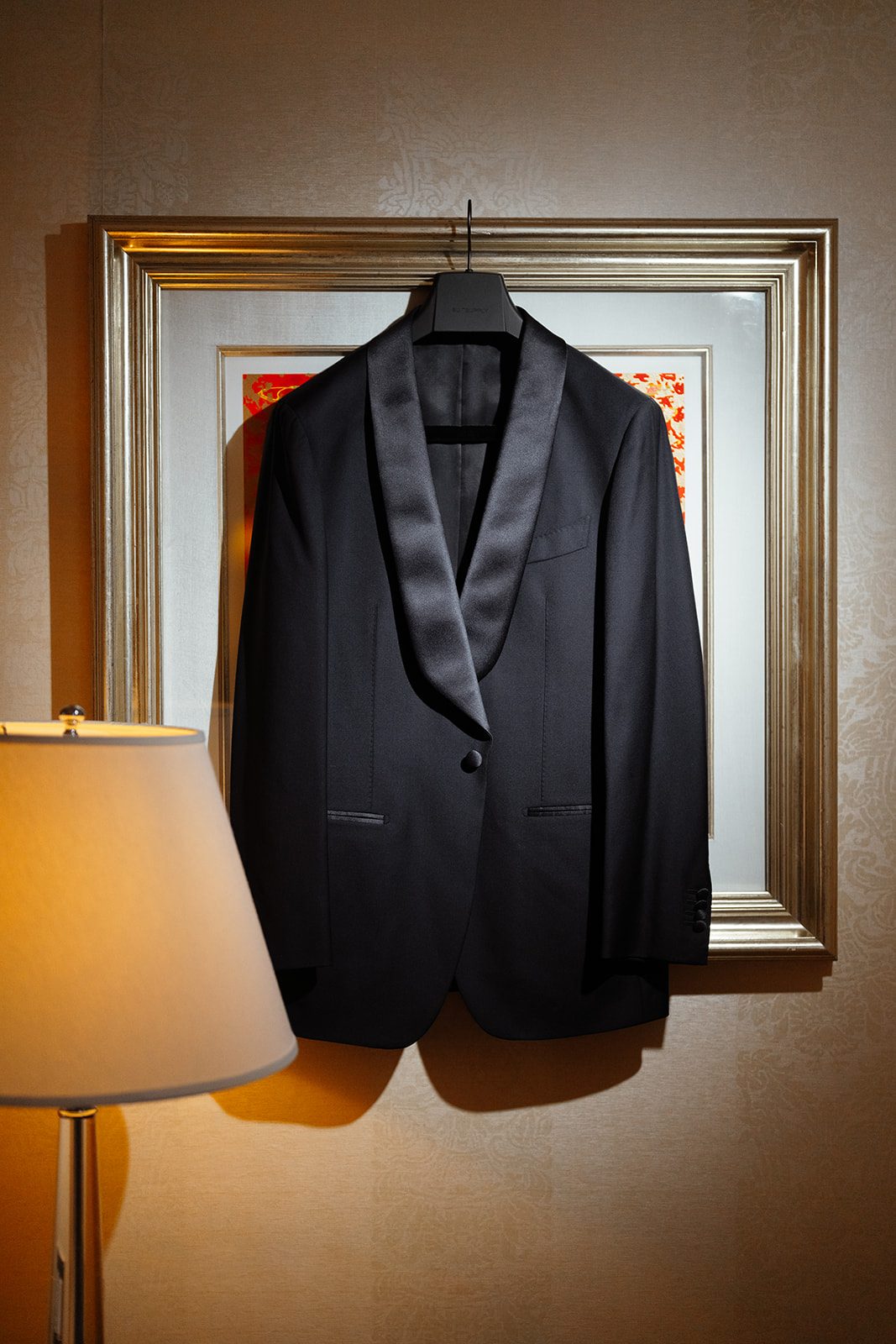 The groom&rsquo;s tuxedo hanging in the suite at The Pierre