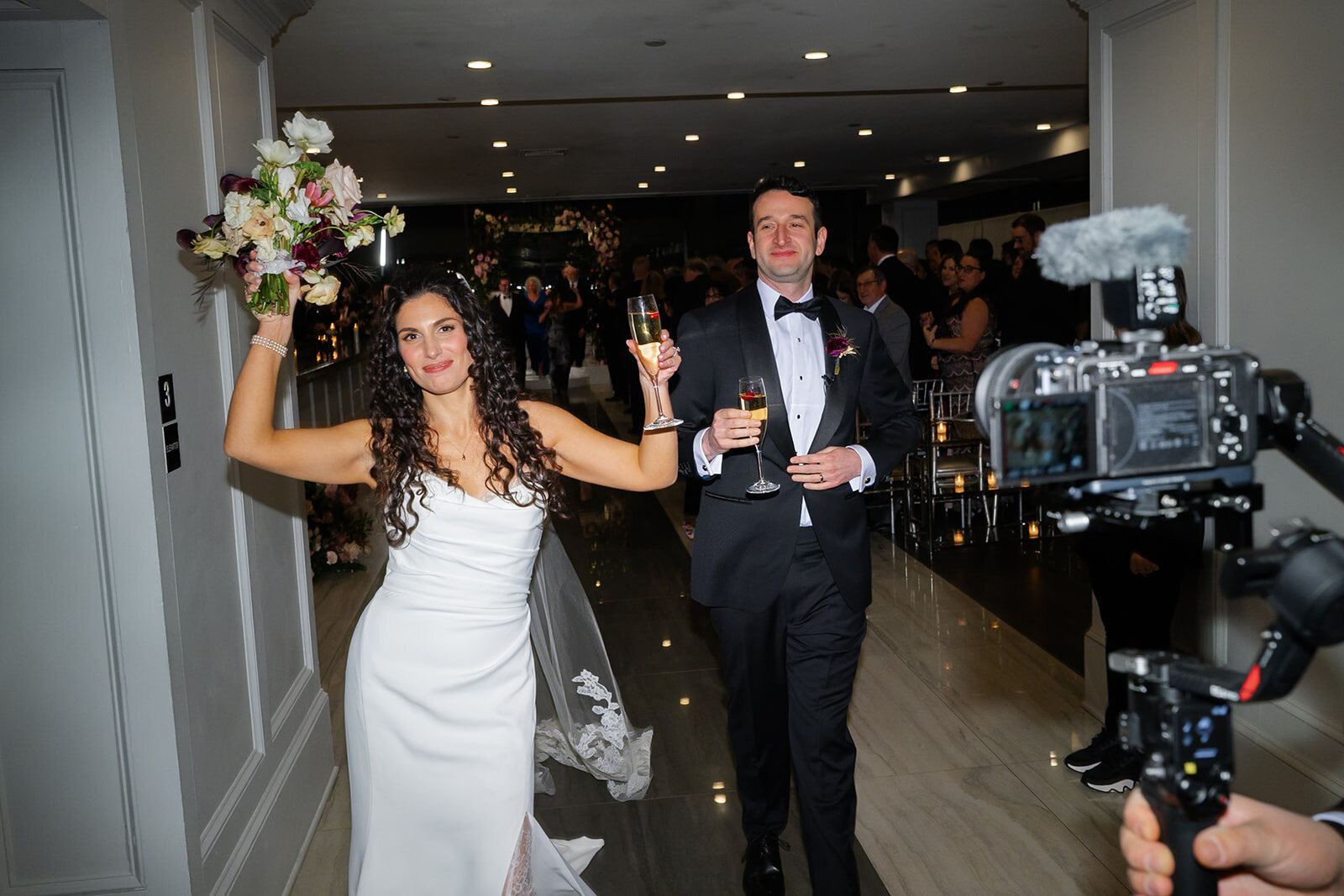 Ellie and Harrison make their grand entrance into the ballroom