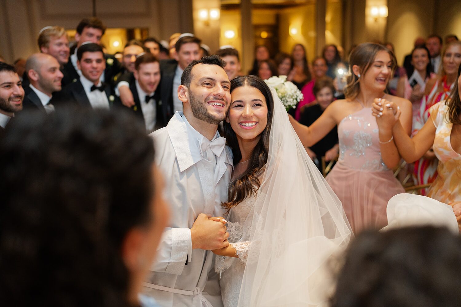 Dana and Mark beam as they walk back up the aisle married at Glen Island Harbour Club.
