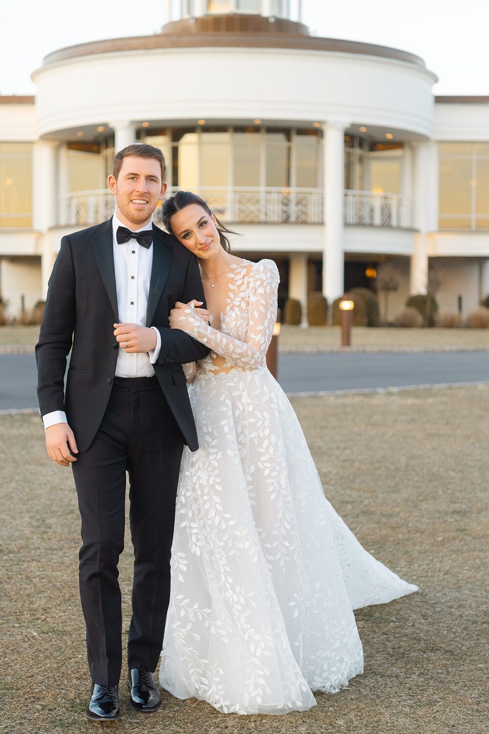 Orly and Jeremy pose before the rotunda of Glen Island Harbour Club.