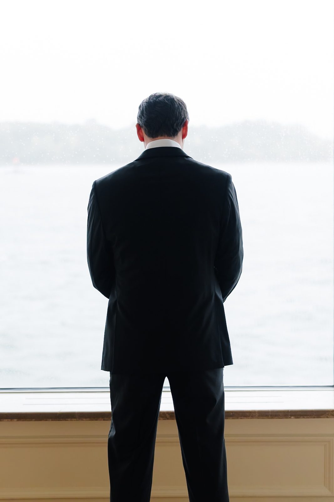David waiting at the window over Long Island Sound before the first look