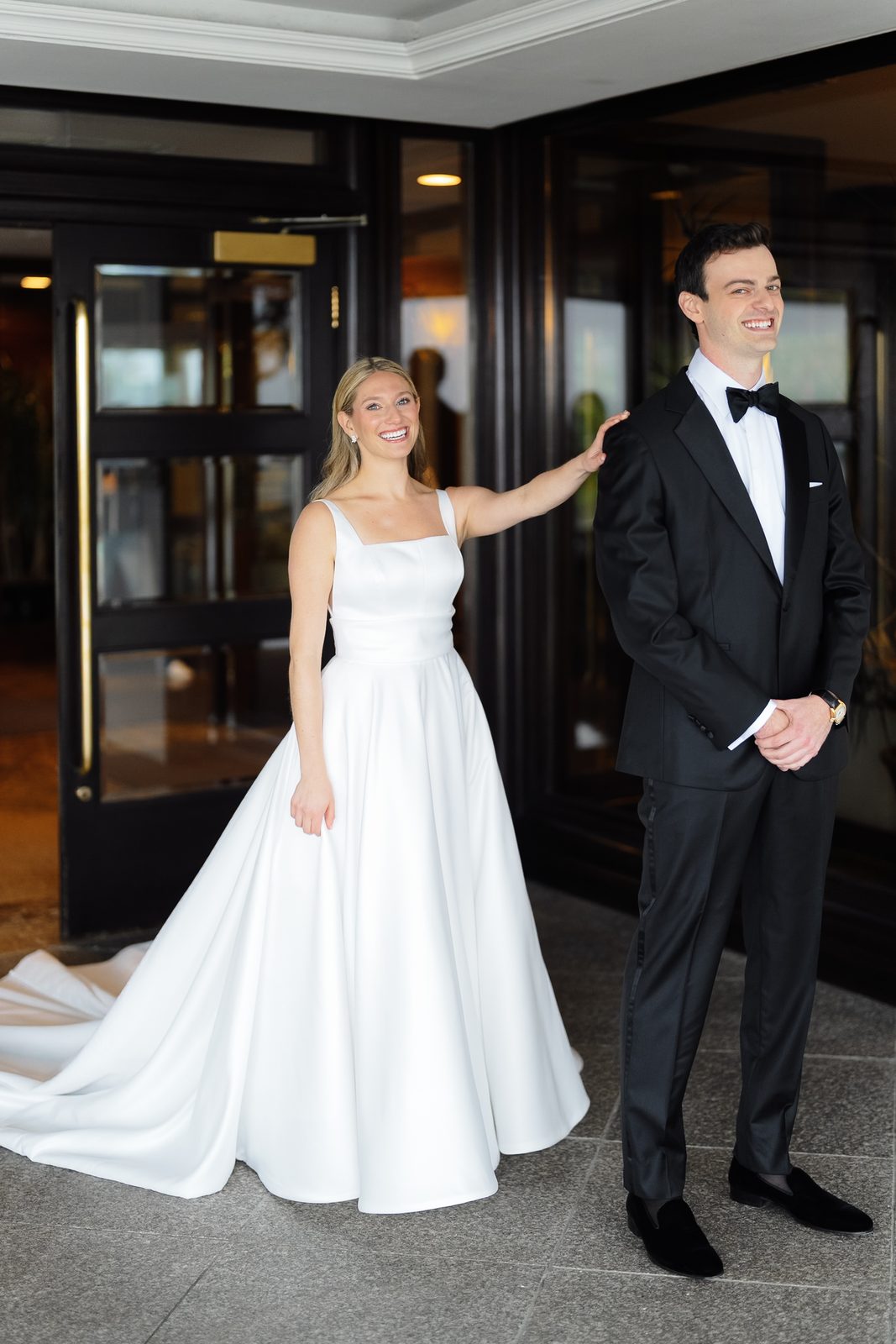 Hana tapping David on the shoulder for their first look at Glen Island Harbour Club
