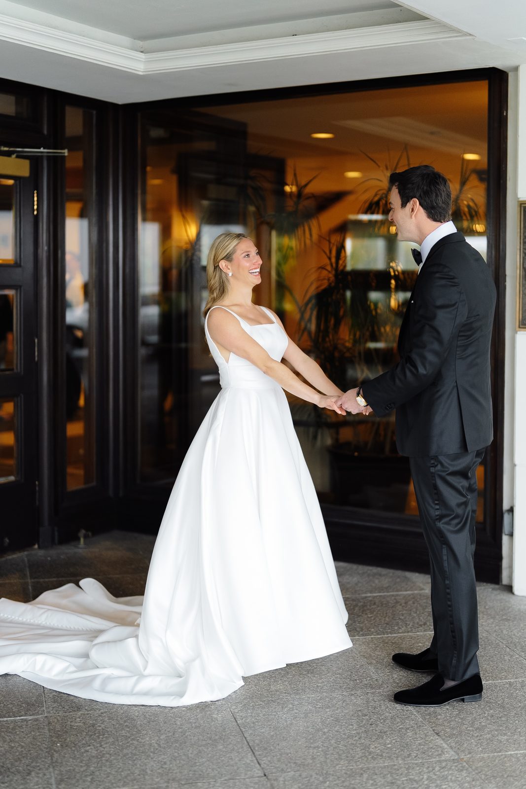Hana and David holding hands at their first look