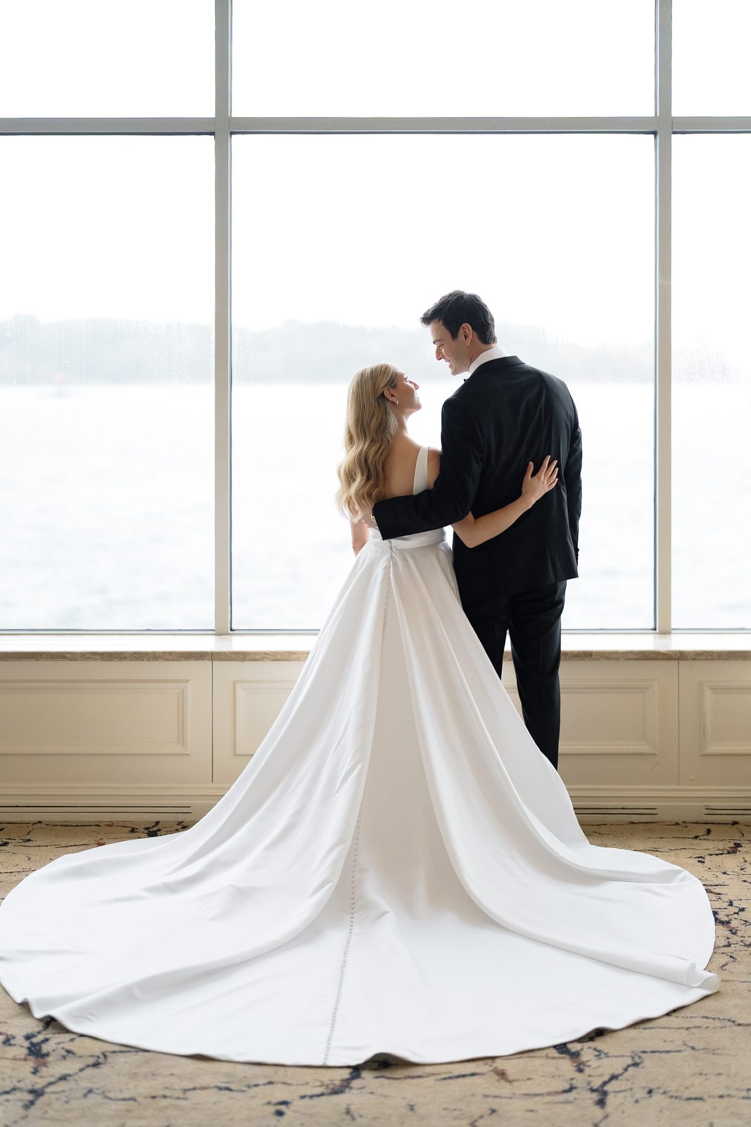 Hana and David at the windows overlooking Long Island Sound