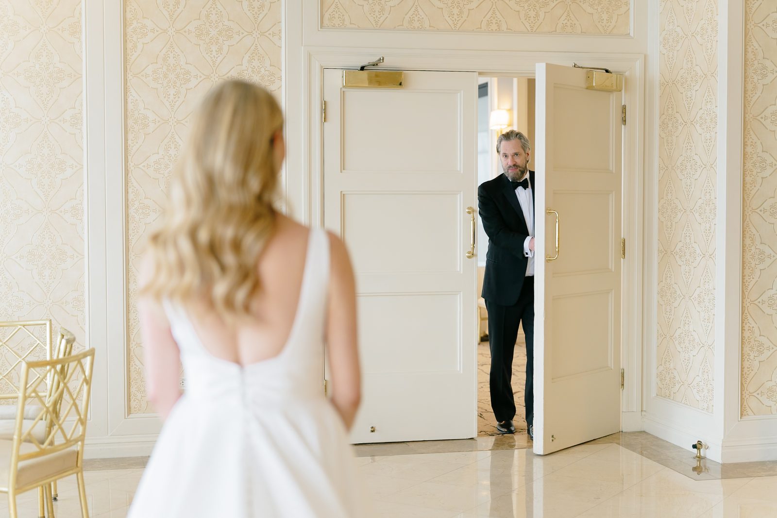 Hana waiting as her father comes through the door for their first look