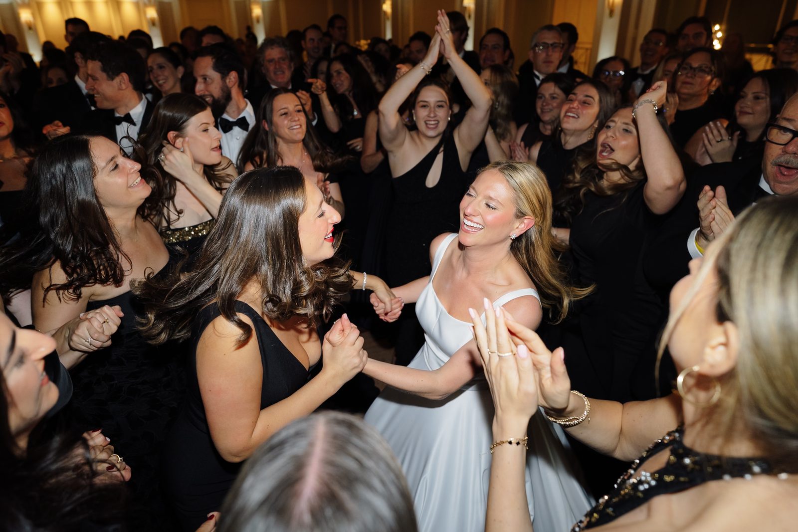 Guests dancing the hora around Hana at Glen Island Harbour Club