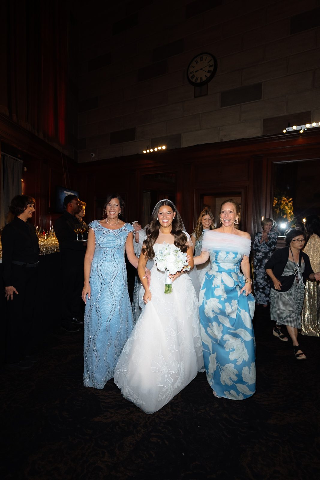 Jessie during the processional at Gotham Hall, walking in between her mothers