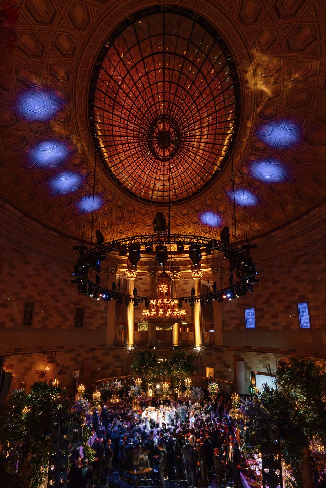 The stained-glass dome above the Grand Ballroom at Gotham Hall, lit from below during the reception