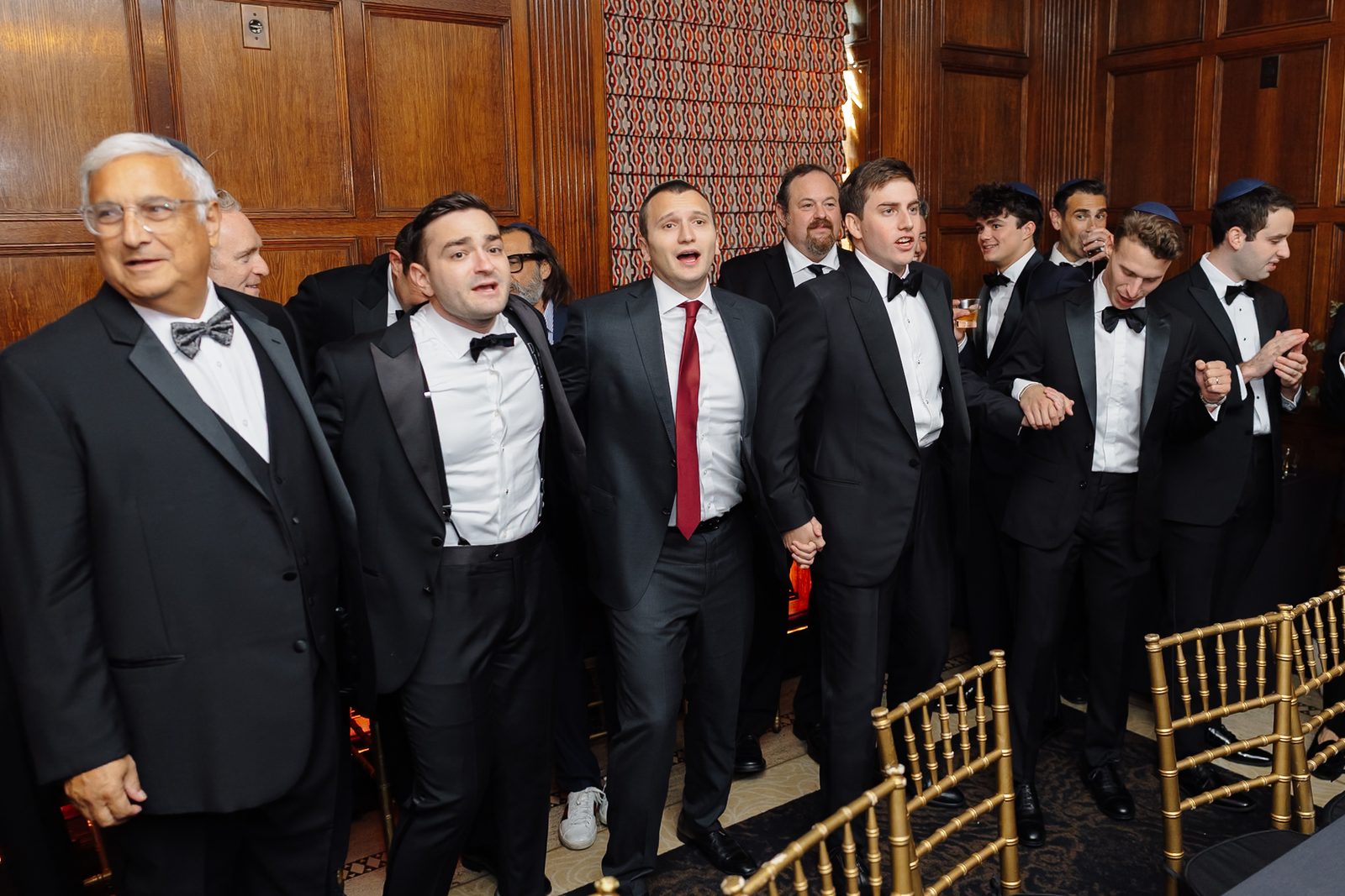 Linus surrounded by friends and family singing at the tisch before the ceremony