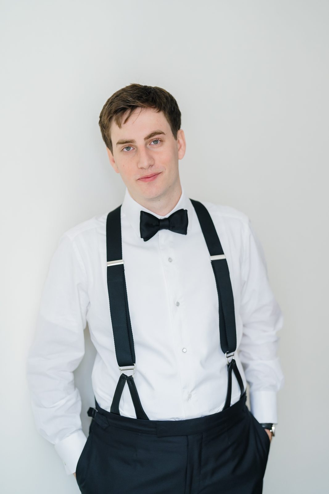 Linus in his bow tie and suspenders getting ready at The Langham, Fifth Avenue