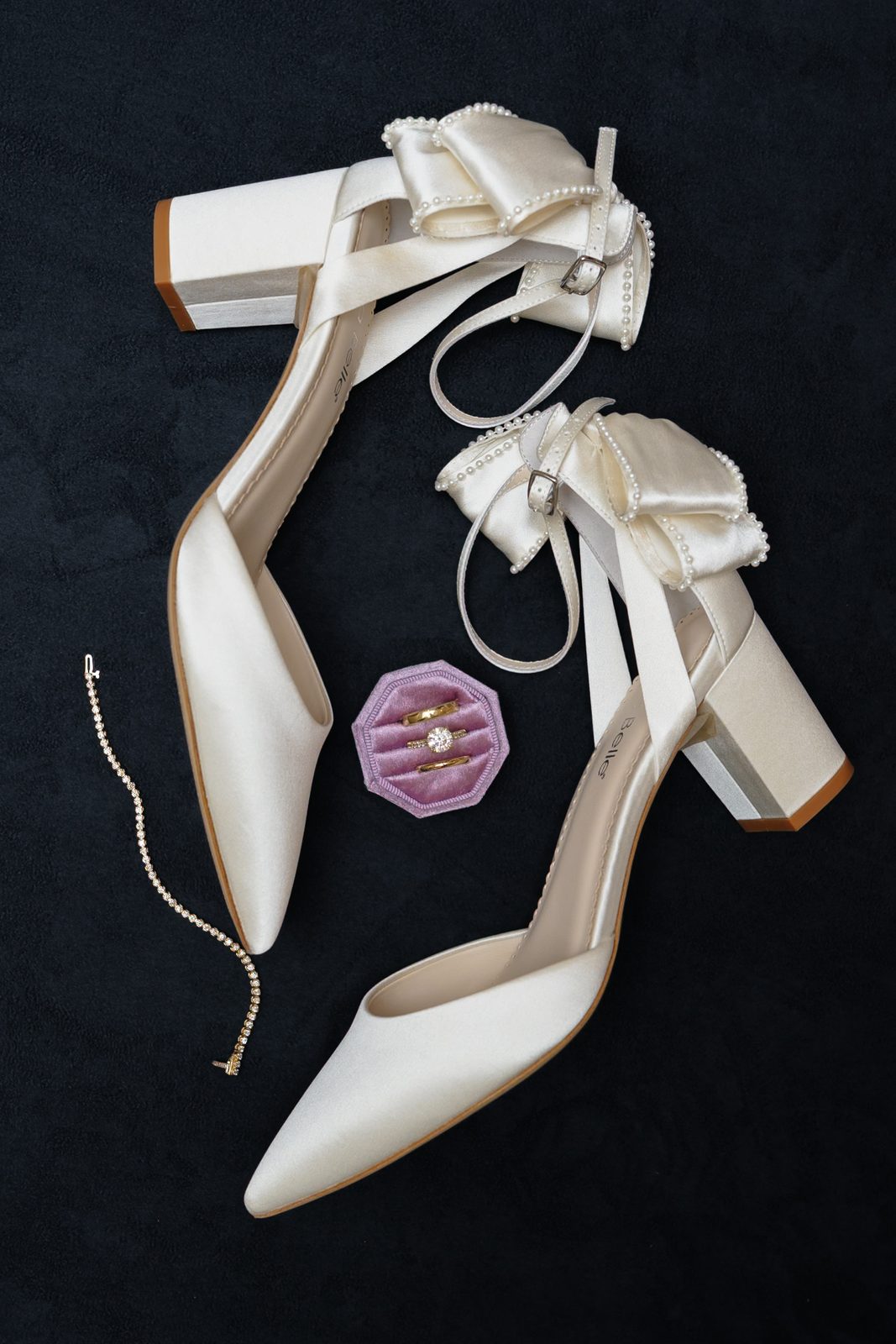 The bride&rsquo;s bow-back heels before a Greentree Country Club wedding