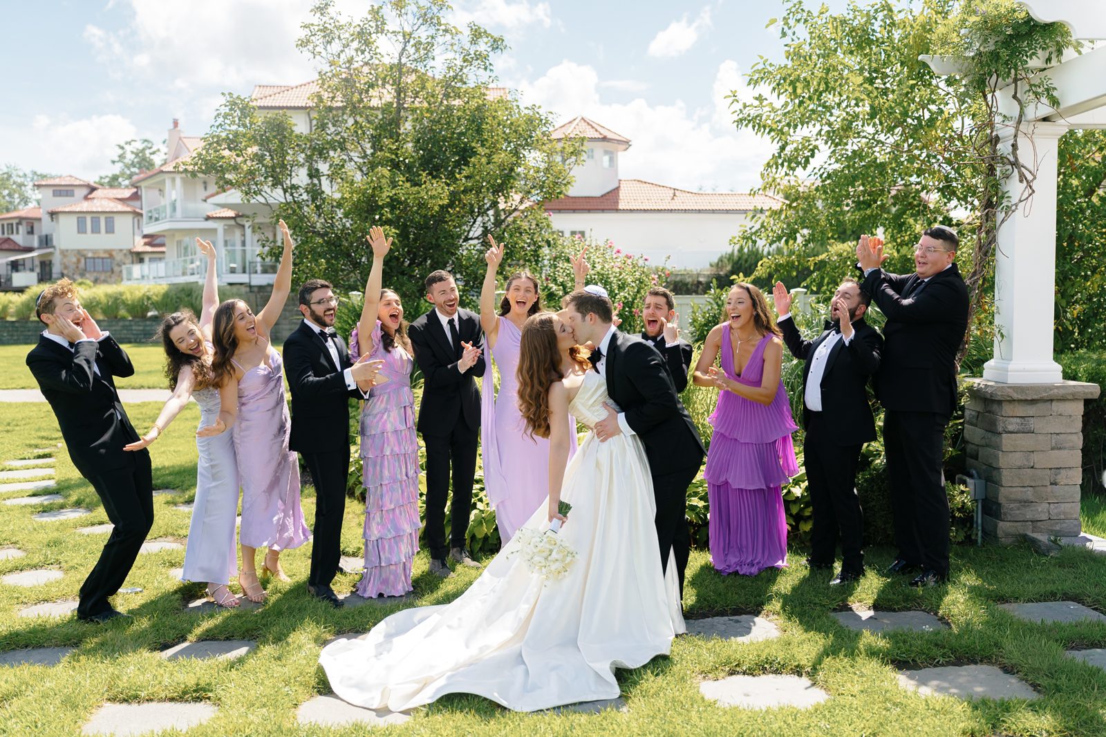 The bridal party celebrating on the lawn at Greentree Country Club, New Rochelle NY