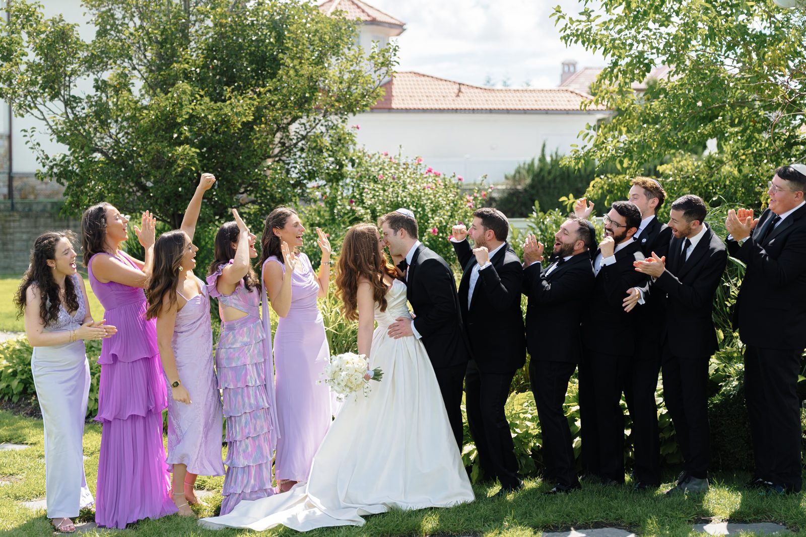 The full bridal party cheering at Greentree Country Club