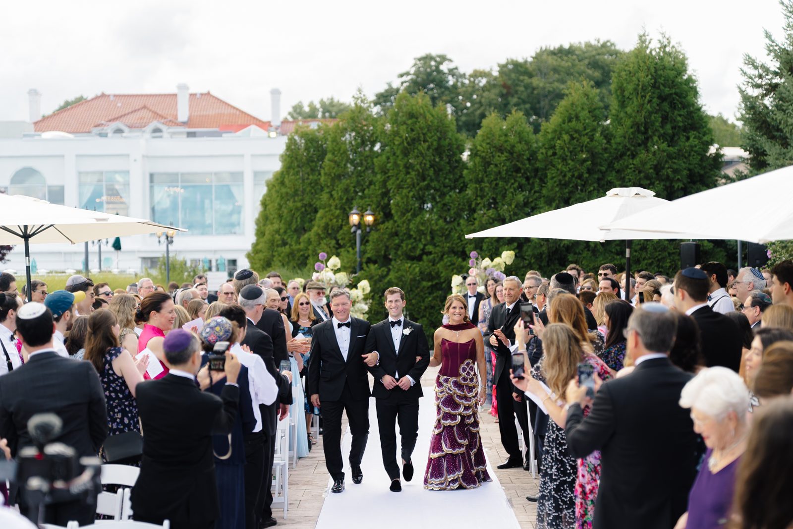 The processional at the outdoor ceremony at Greentree Country Club