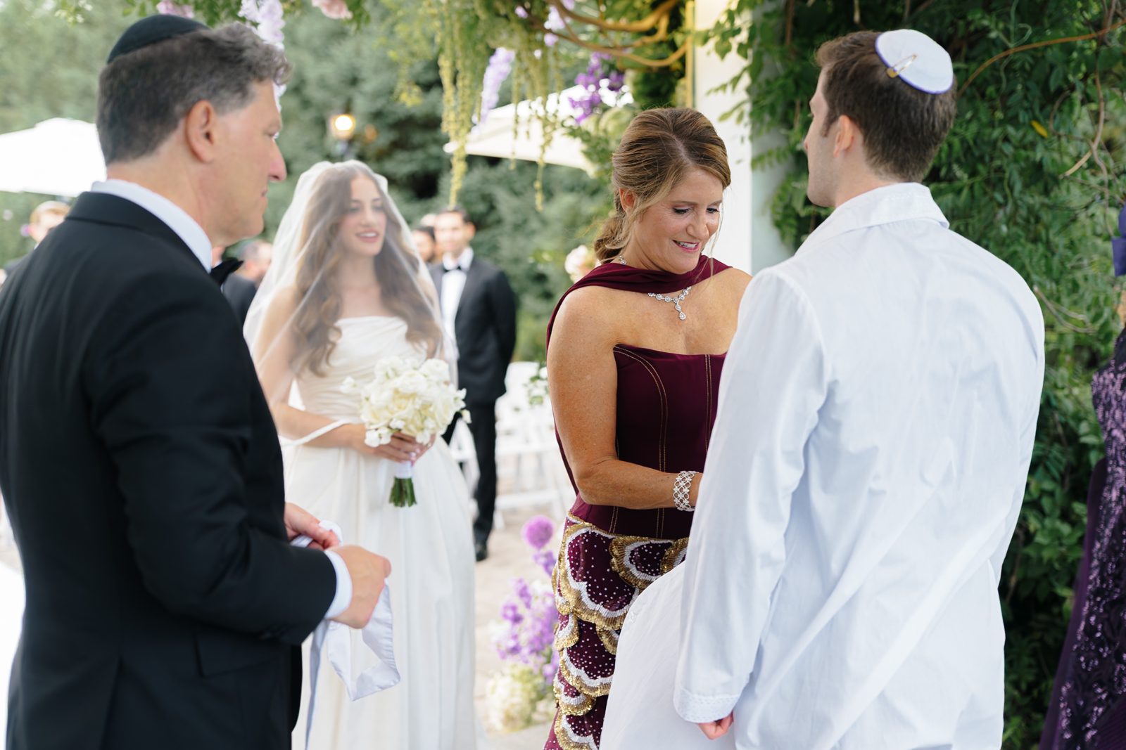Vows under the lavender chuppah at Greentree Country Club