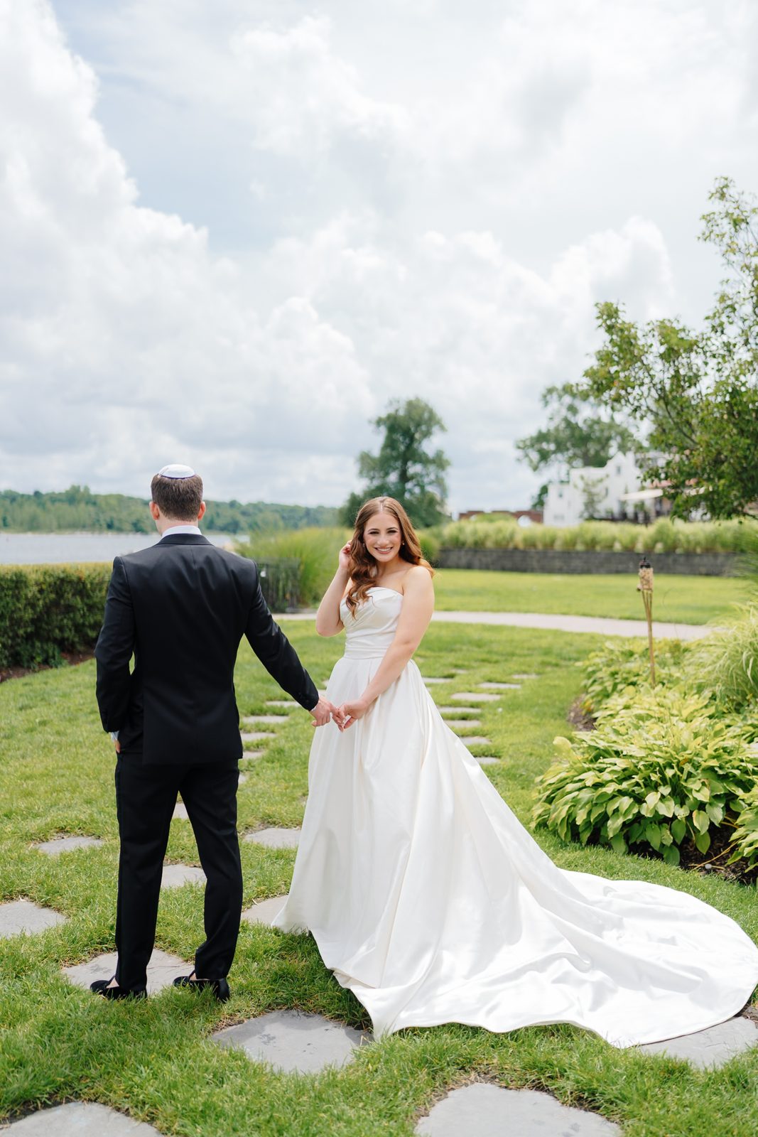 Bride and groom on the great lawn at Greentree Country Club, New Rochelle NY