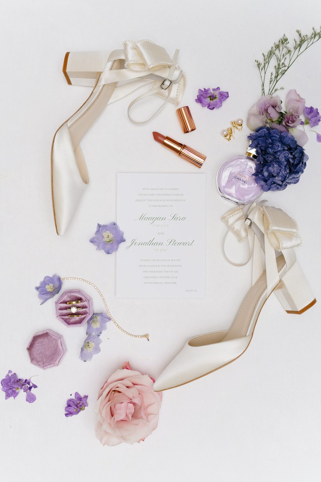 Wedding day details — heels, invitation, and lavender florals at Greentree Country Club, New Rochelle NY