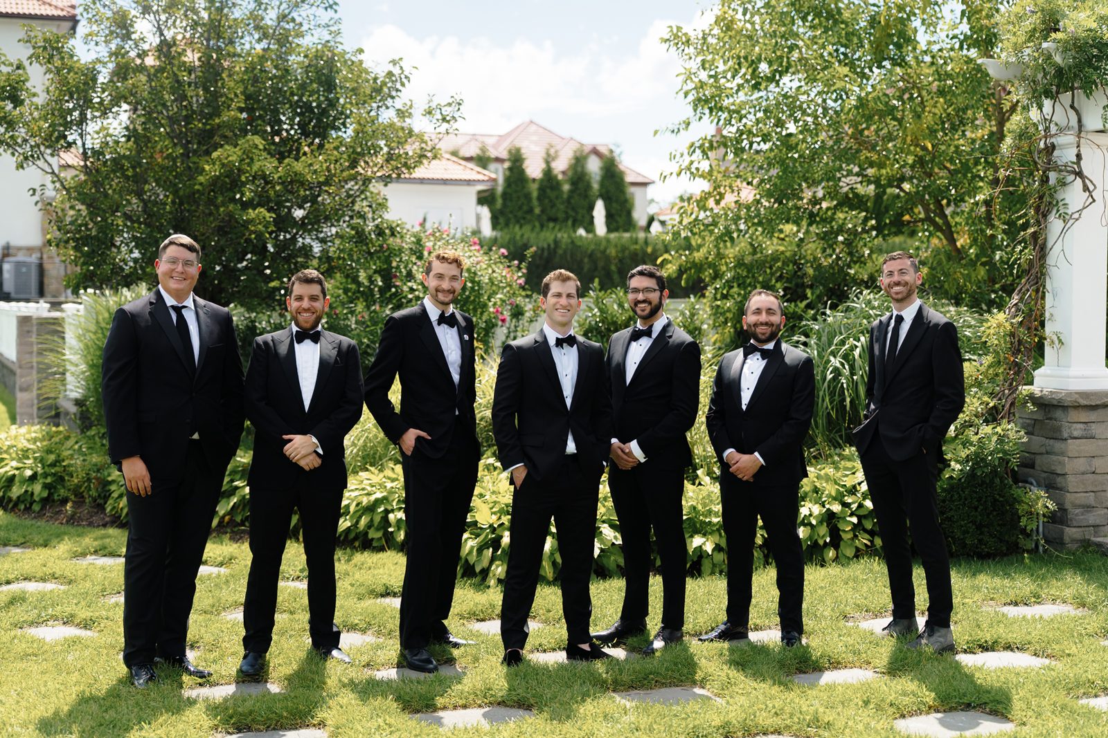 Jon with his groomsmen on the lawn at Greentree Country Club