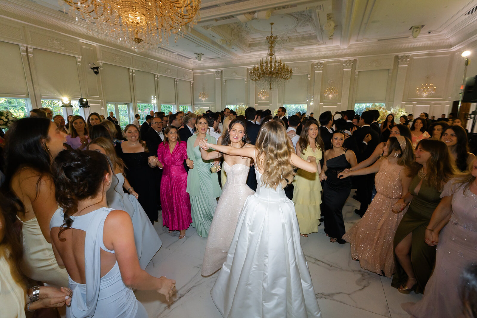 Noa and Nate enter the first hora as the ballroom fills