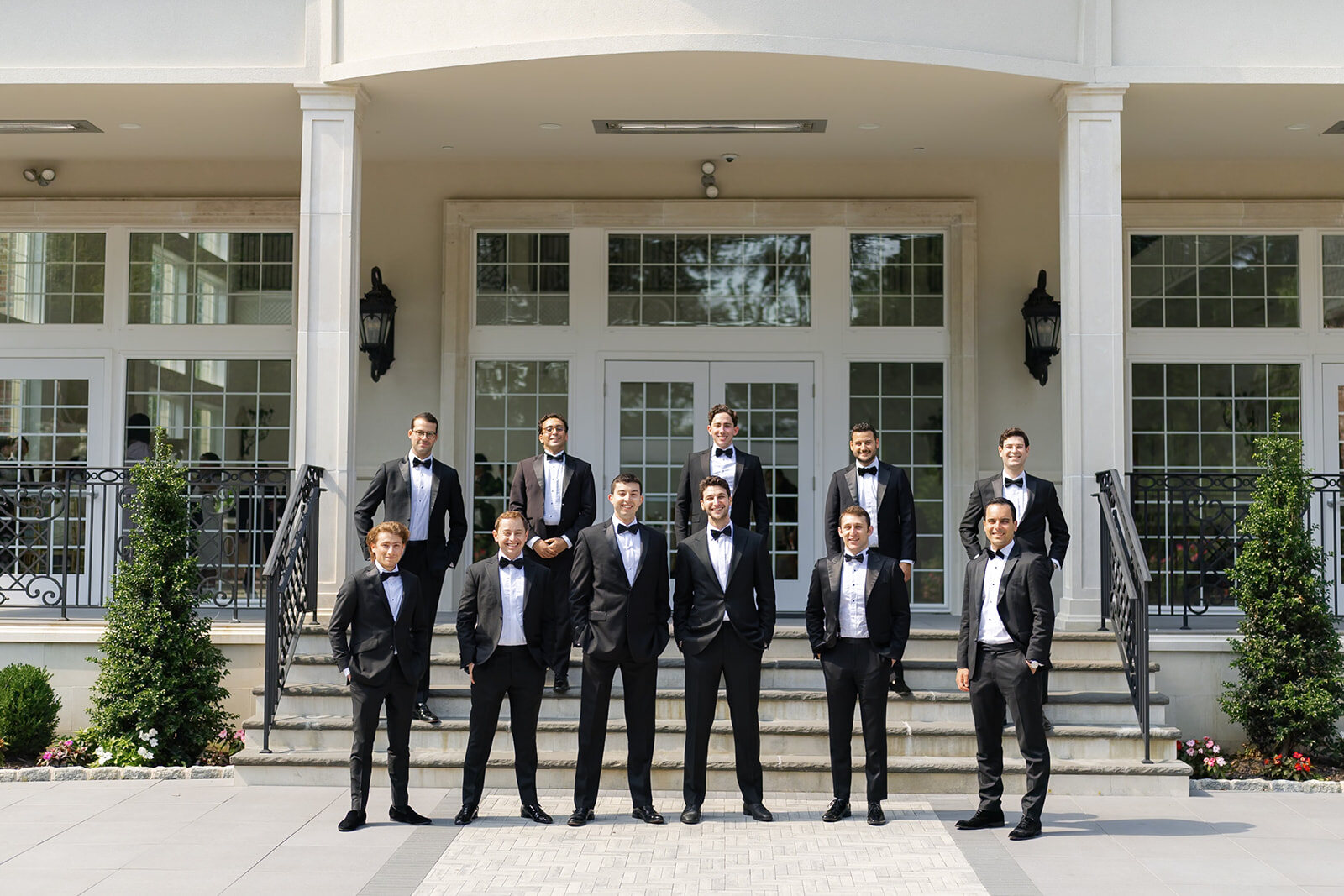 Nate and his groomsmen on the steps of the estate’s white portico