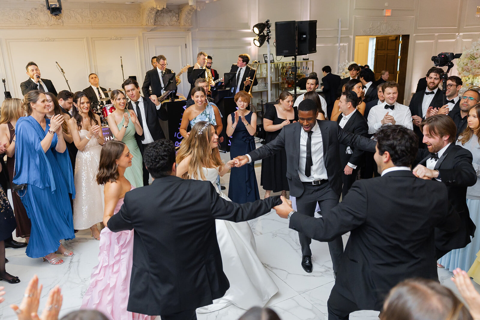 Nate dances with his friends in the middle of the hora