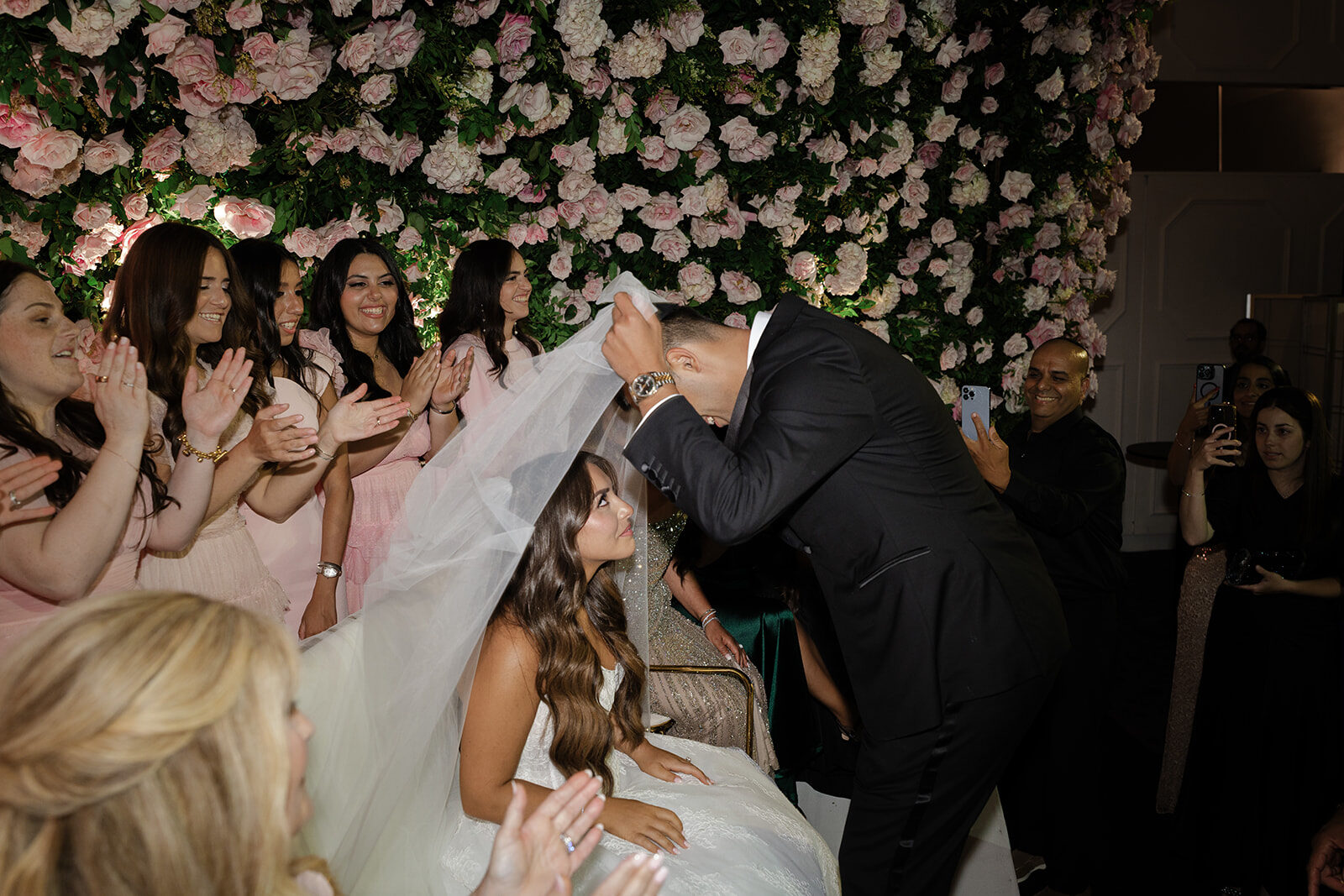 Ben veils Ashley at the bedeken at Old Westbury Hebrew Congregation