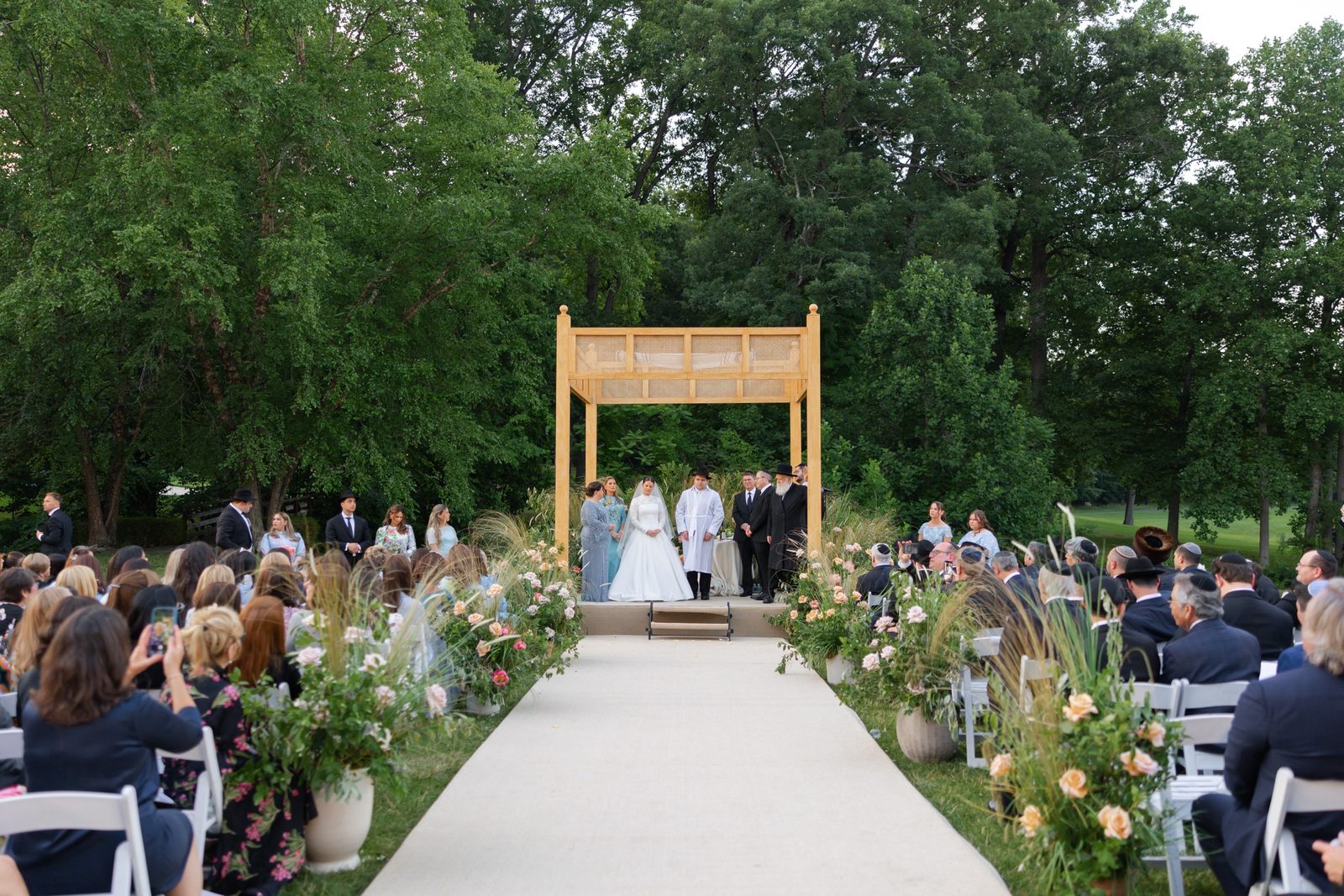 The aisle leading through the garden to the chuppah