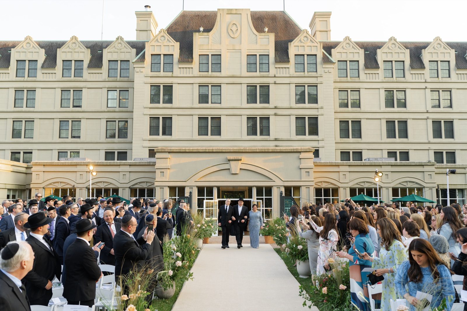 The outdoor ceremony with the Hilton Pearl River facade behind the guests