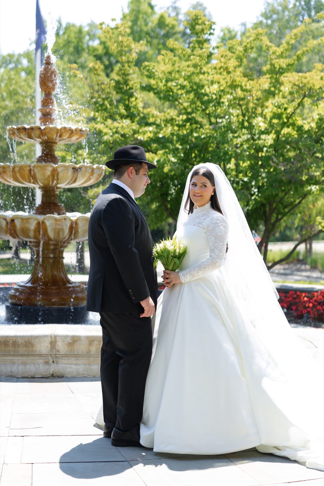 Goldie and Ezra in front of the fountain
