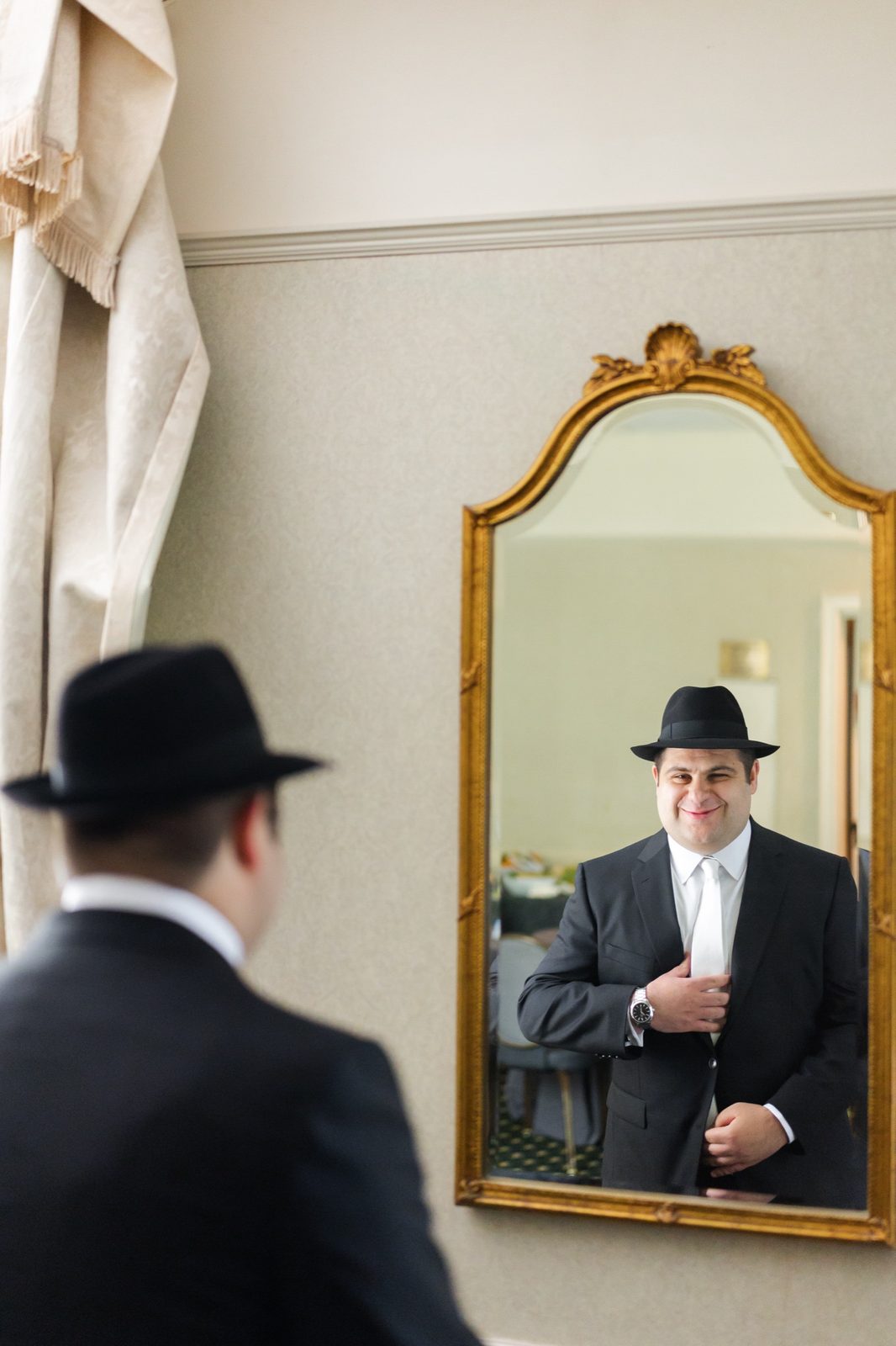 Ezra in the gilded mirror before the ceremony