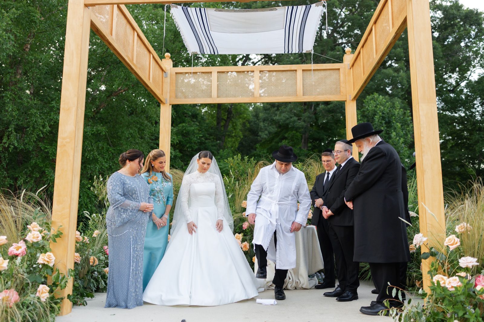 Goldie and Ezra under the wooden chuppah