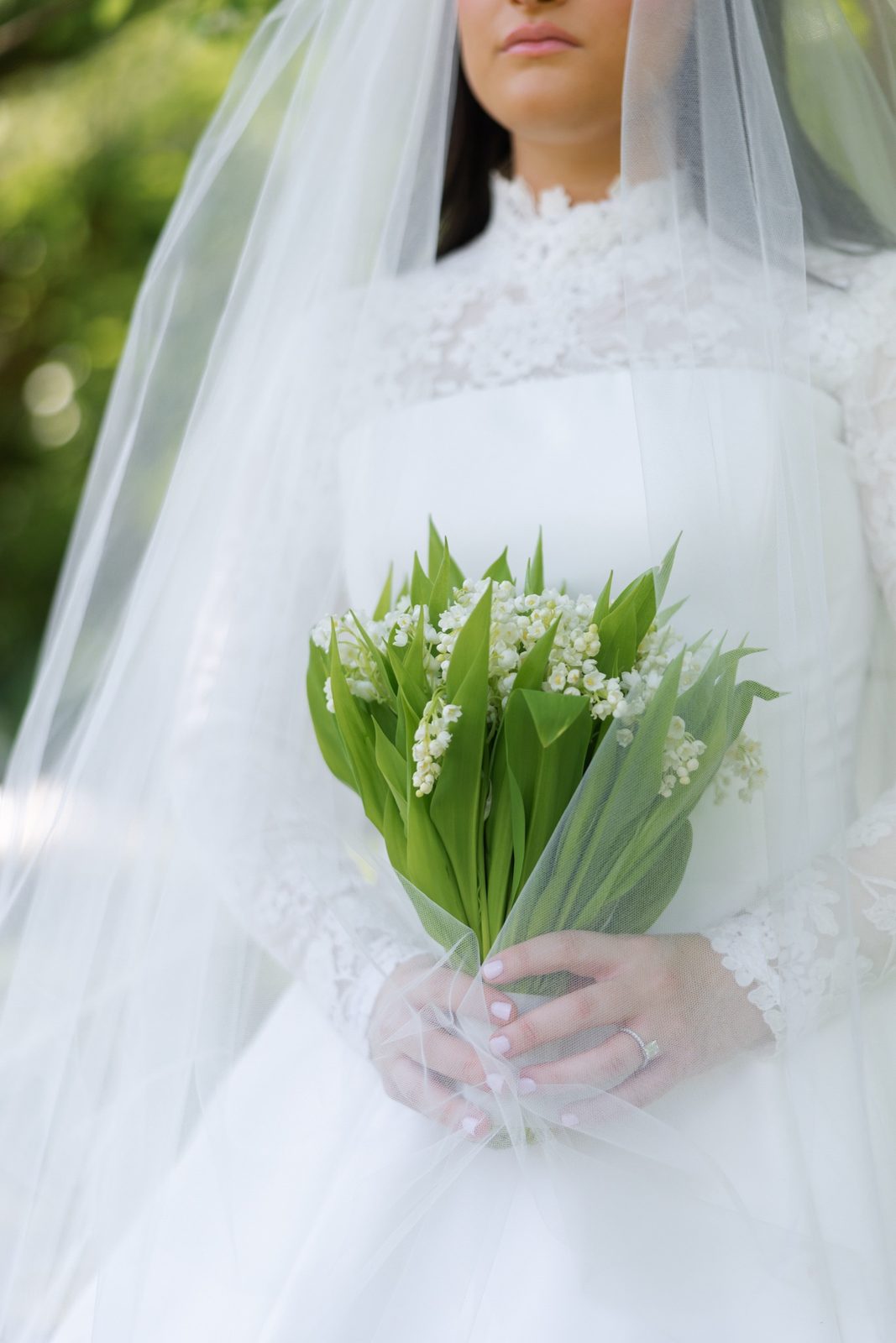 Goldie under her veil with lily of the valley