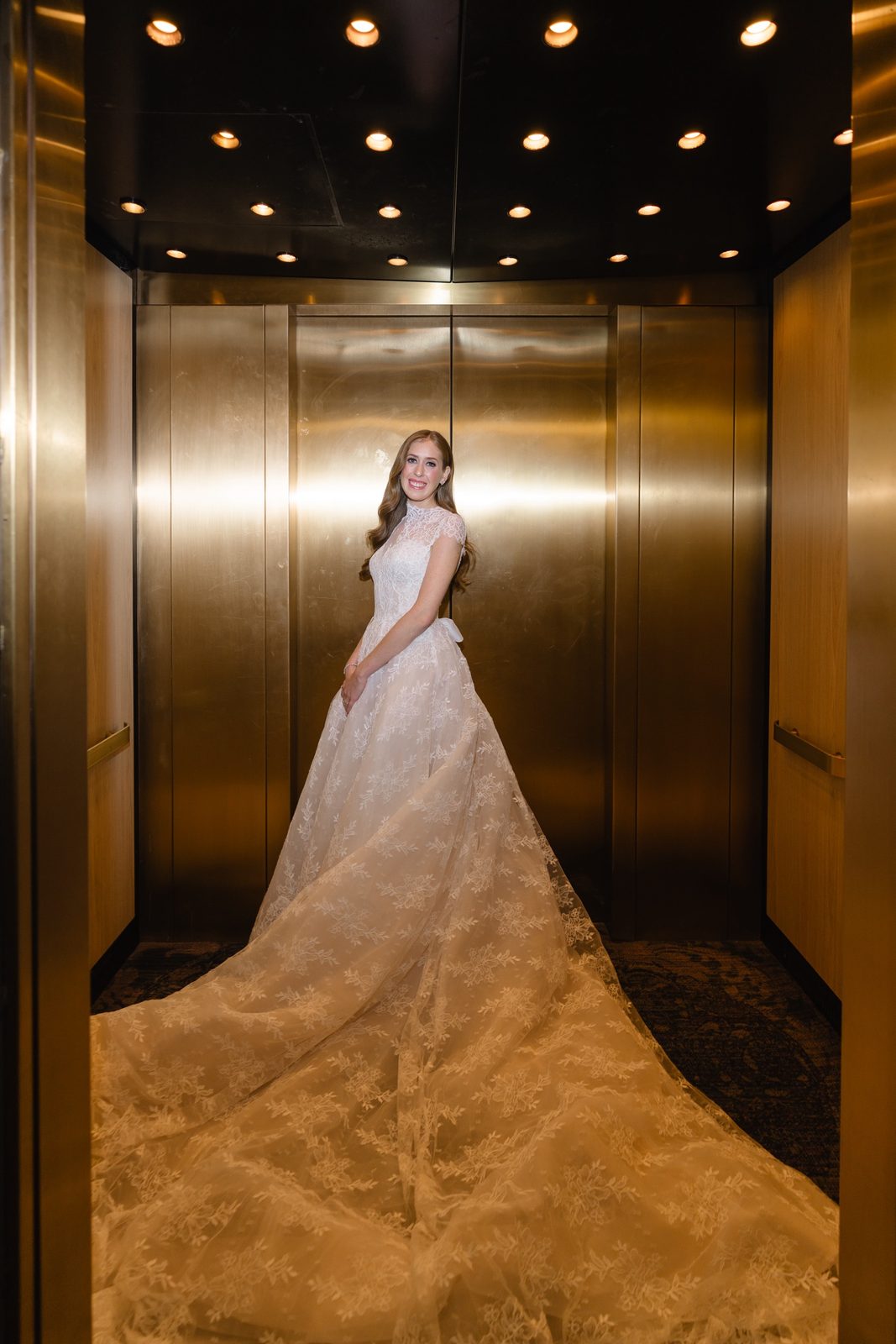Haley in the gold elevator with her train filling the floor