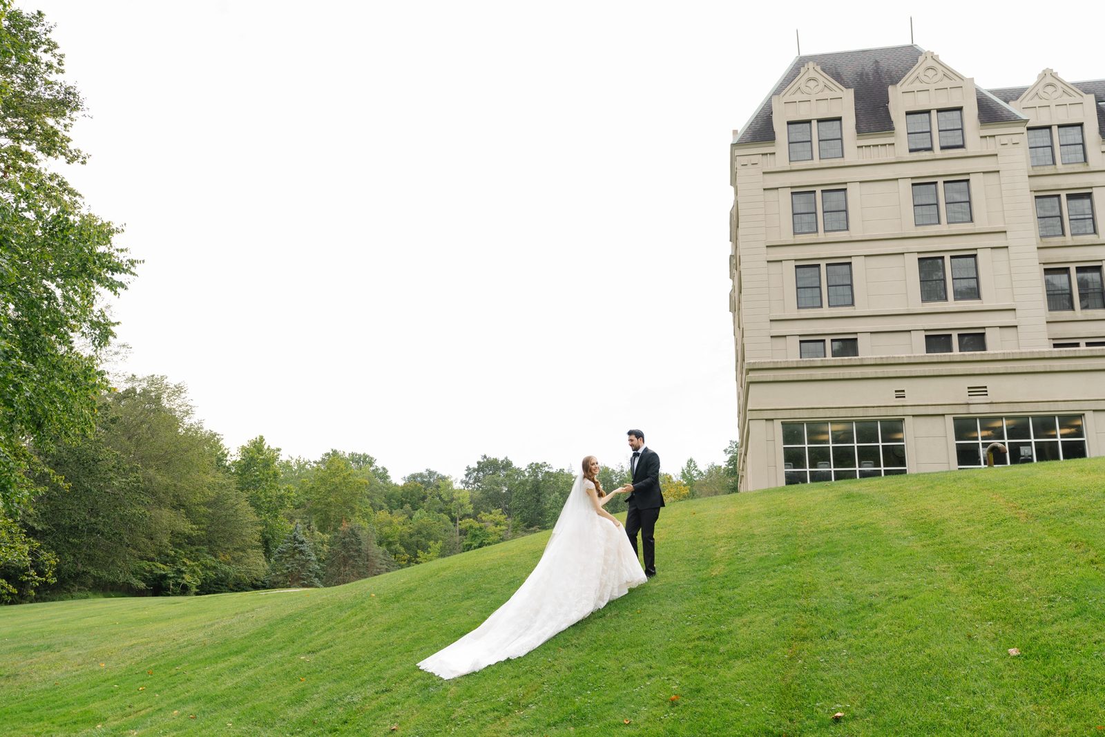 Haley on the great lawn with the Hilton Pearl River behind her
