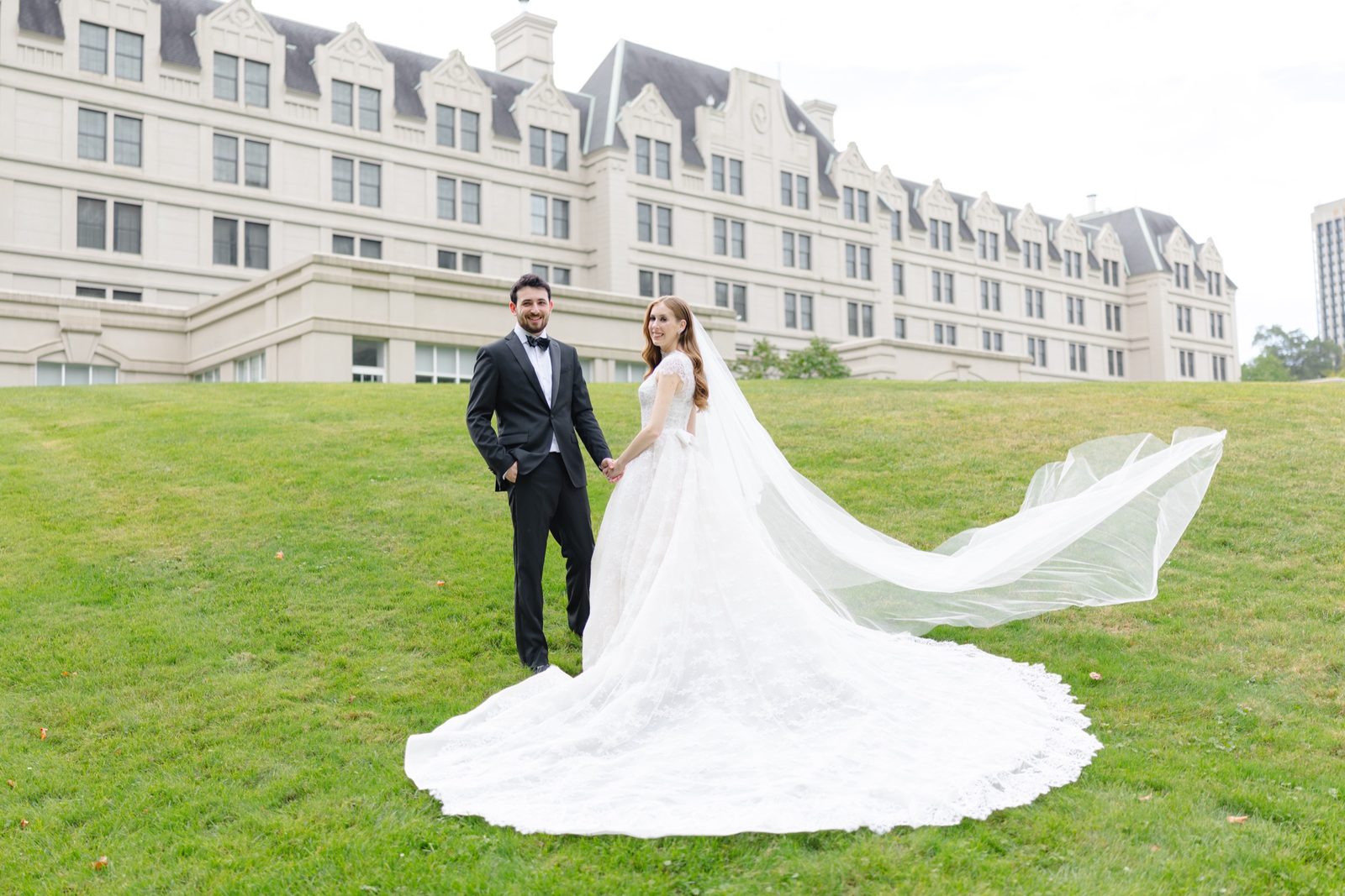 Haley’s veil streaming across the lawn in front of the hotel