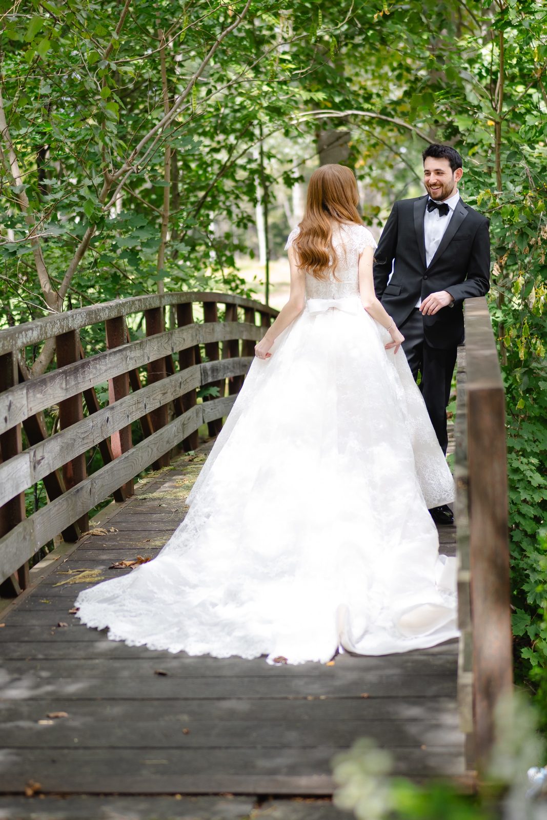 Haley and Evan on the wooden footbridge in the woods
