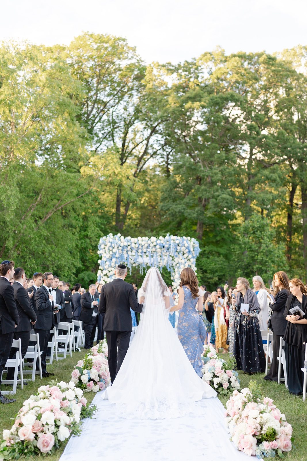 Olivia walking down the aisle on the lawn
