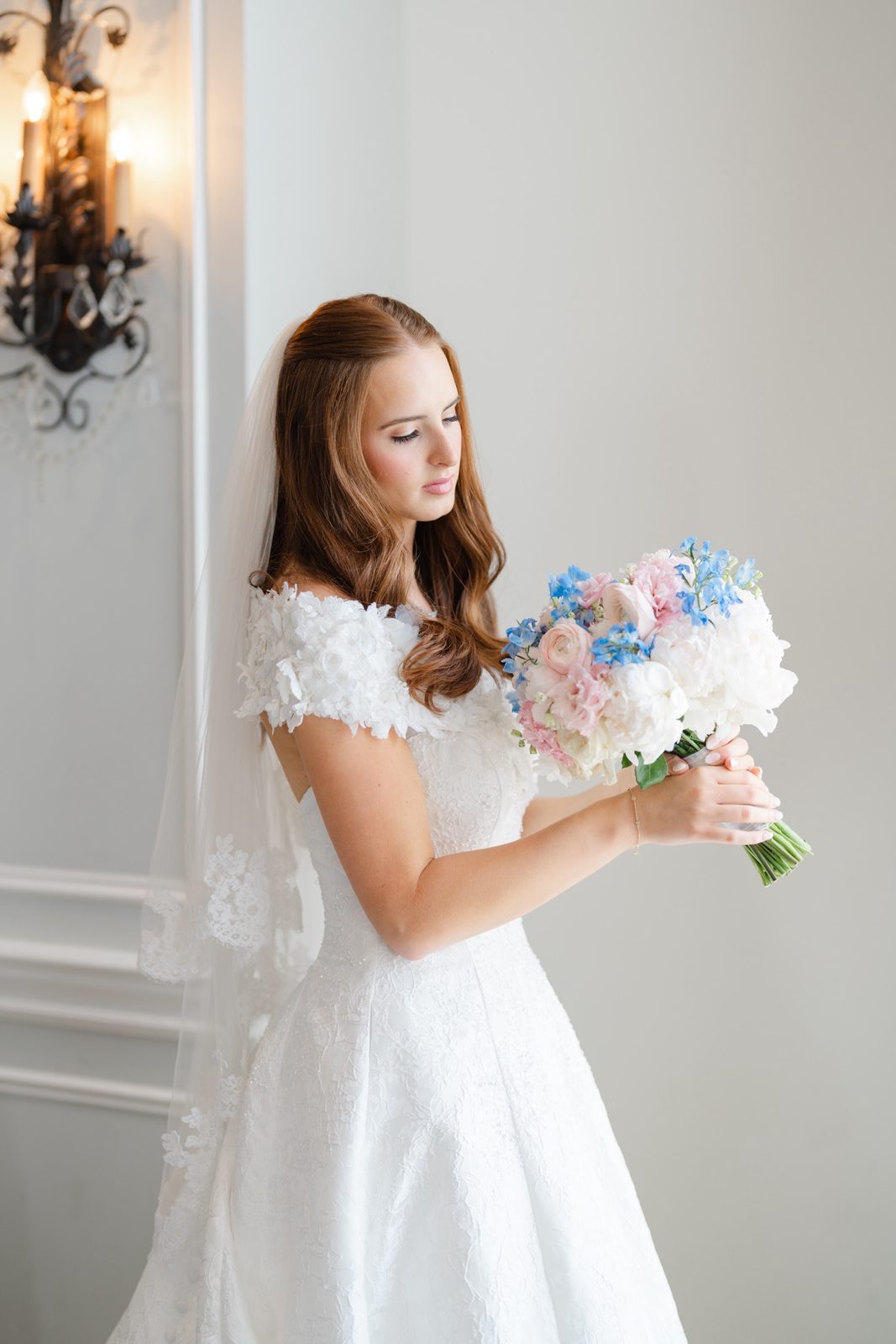 Olivia with her bouquet in the bridal suite