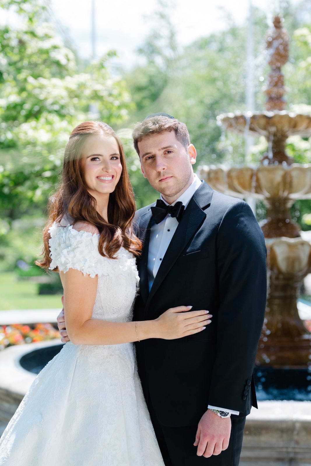 Olivia and Jeremy by the fountain in the courtyard