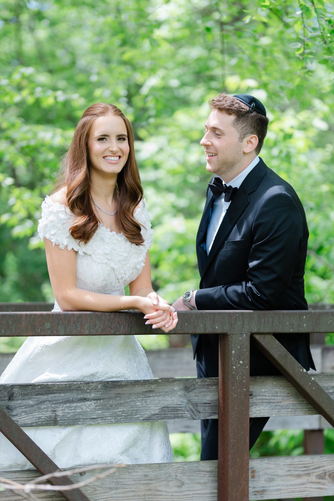 Olivia and Jeremy on the wooden footbridge in the woods behind the hotel