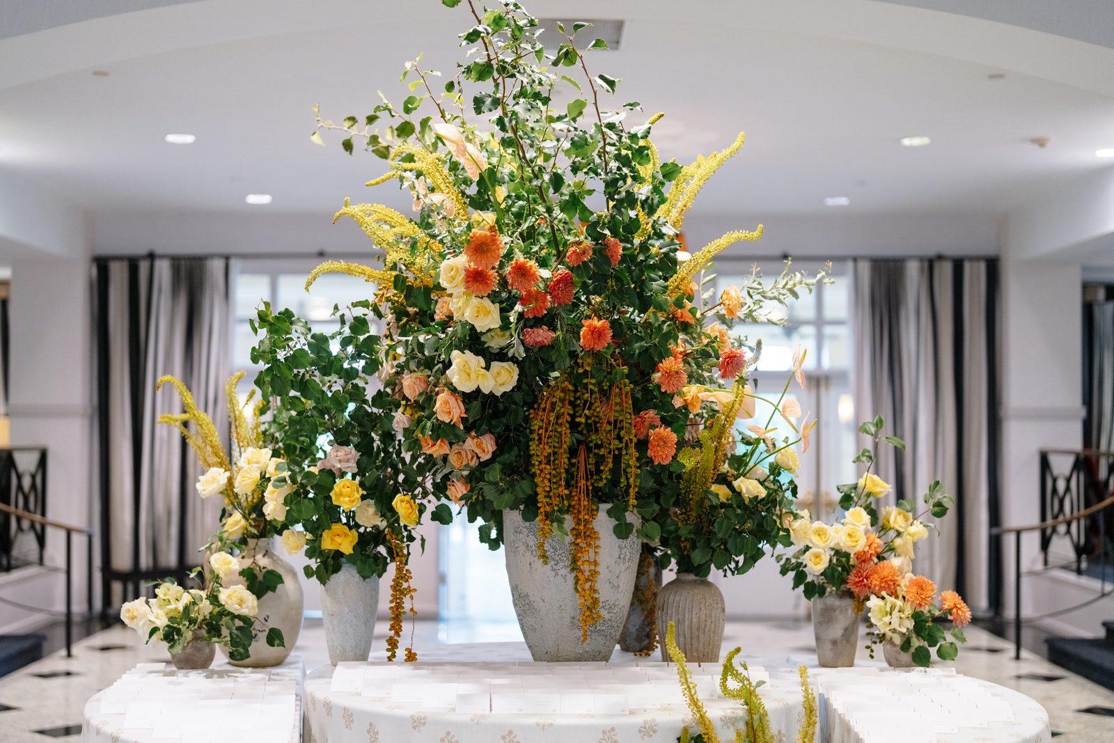 A floral installation in orange and green in the lobby