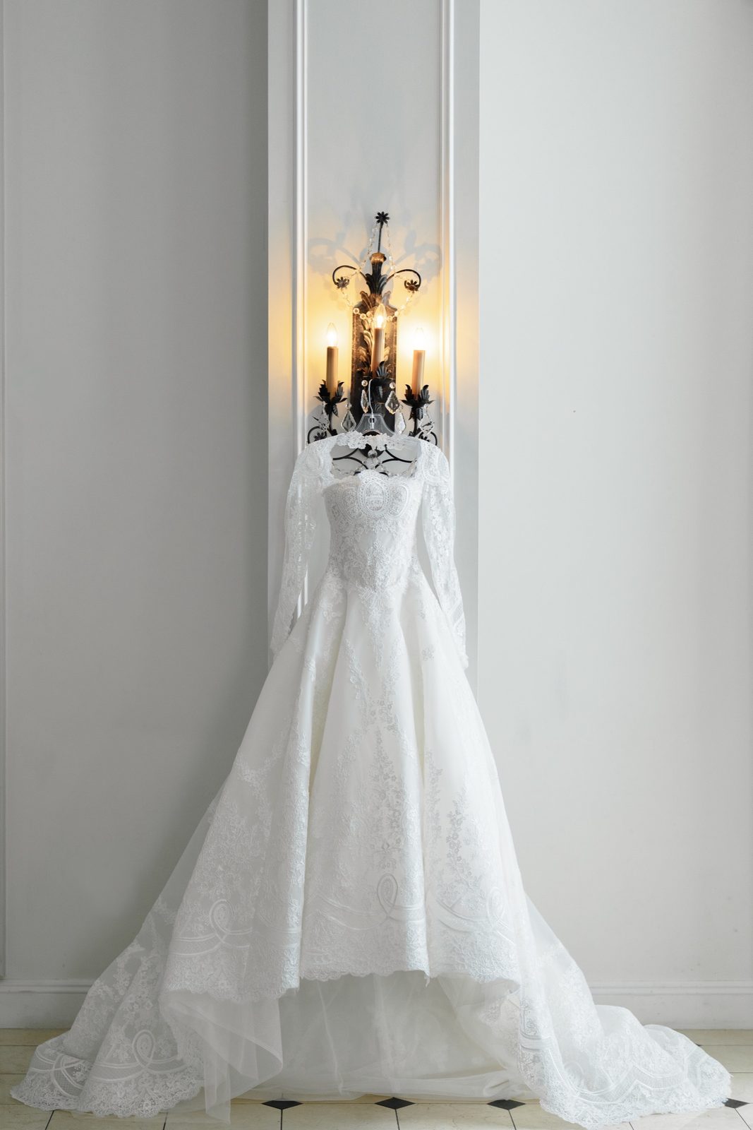 Tommi’s gown hanging by the sconce at the Hilton Pearl River