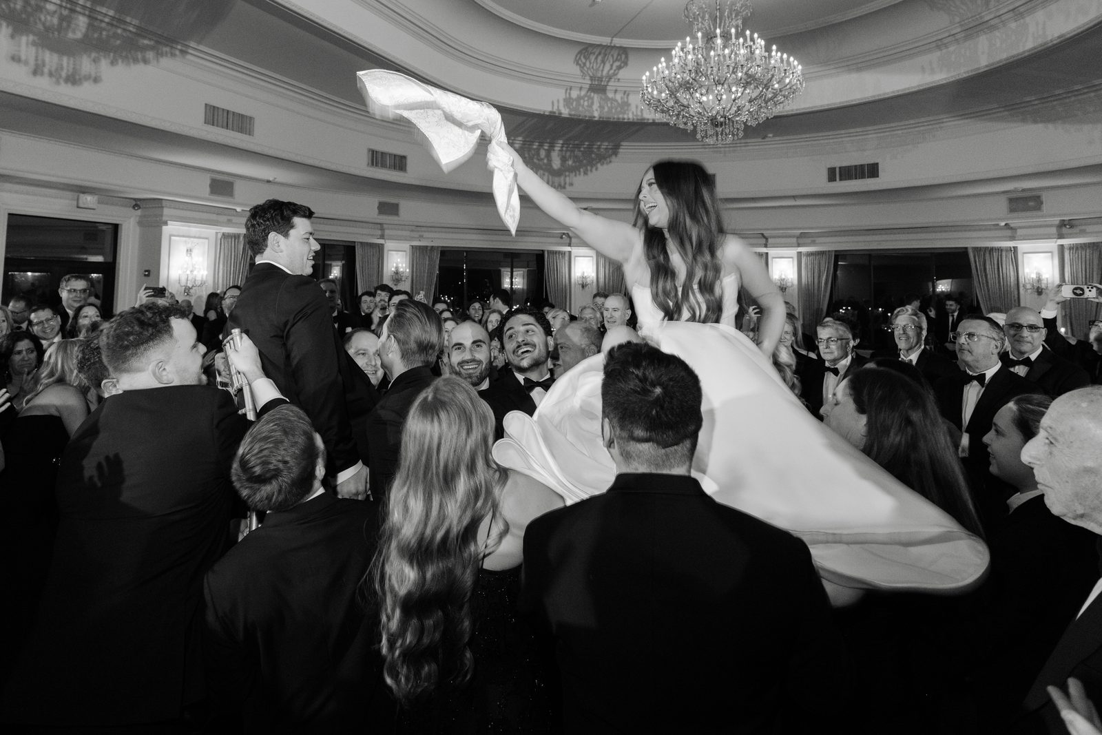 Rachel lifted above the crowd during the hora at Oheka Castle